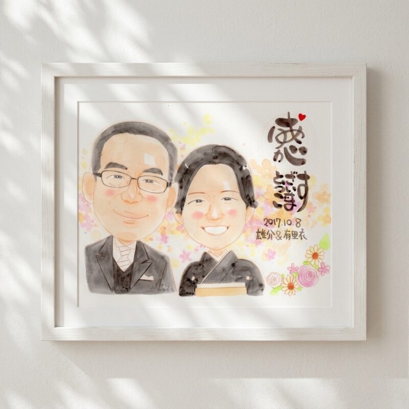似顔絵を手にしたお客様のお喜びの写真